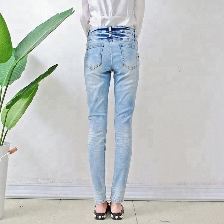 Bulk order china cheap price branded women jeans light blue fancy design ladies skinny jeans